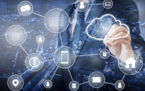 Double exposure of Professional businessman connecting cloud technology network and devices on hand in internet of things , technology , communication and business concept